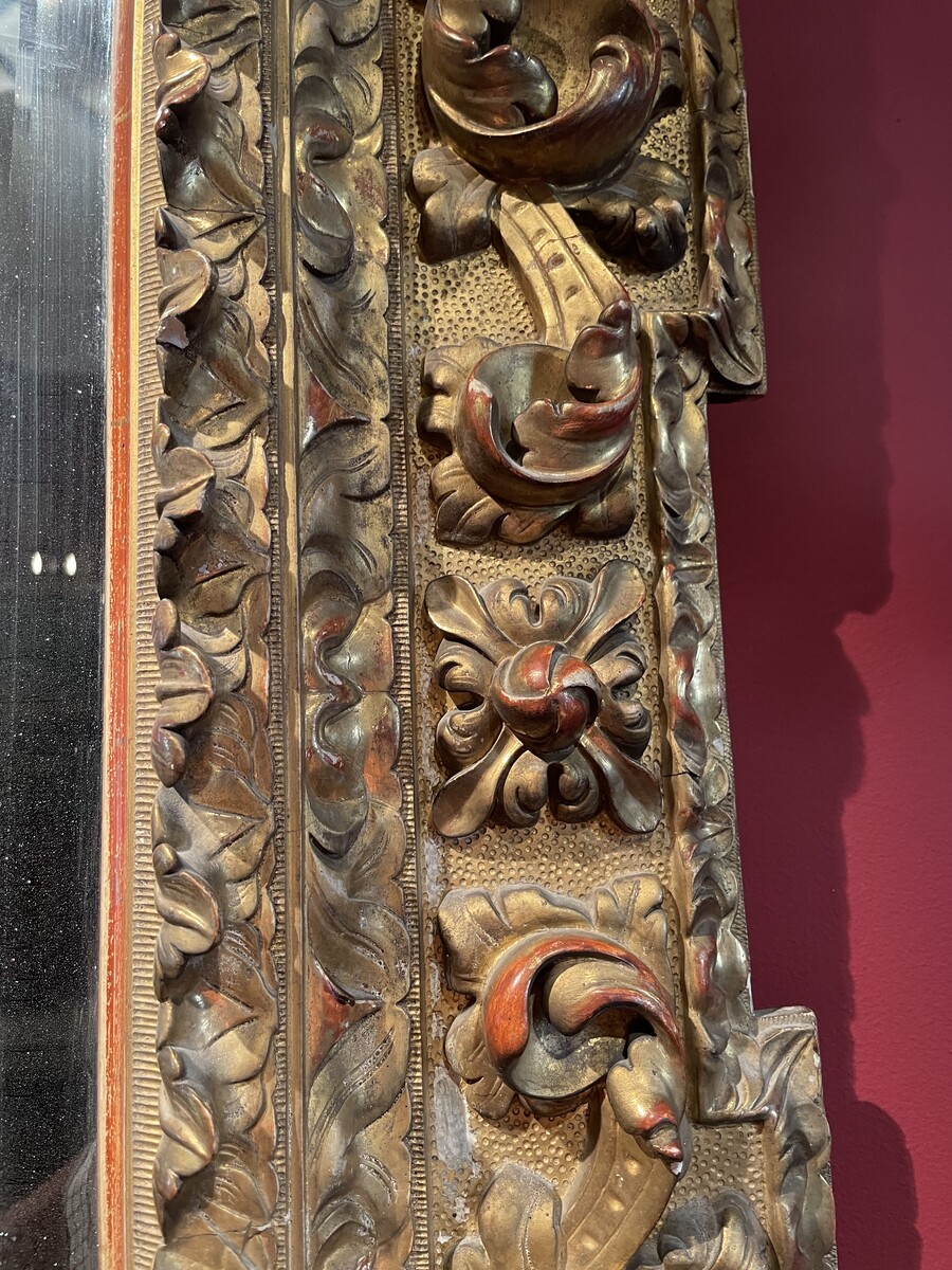 Baroque style mirror, the corners decorated with shells.