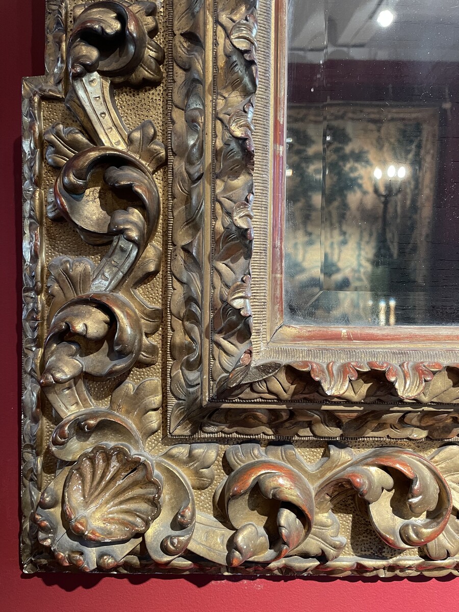 Baroque style mirror, the corners decorated with shells.