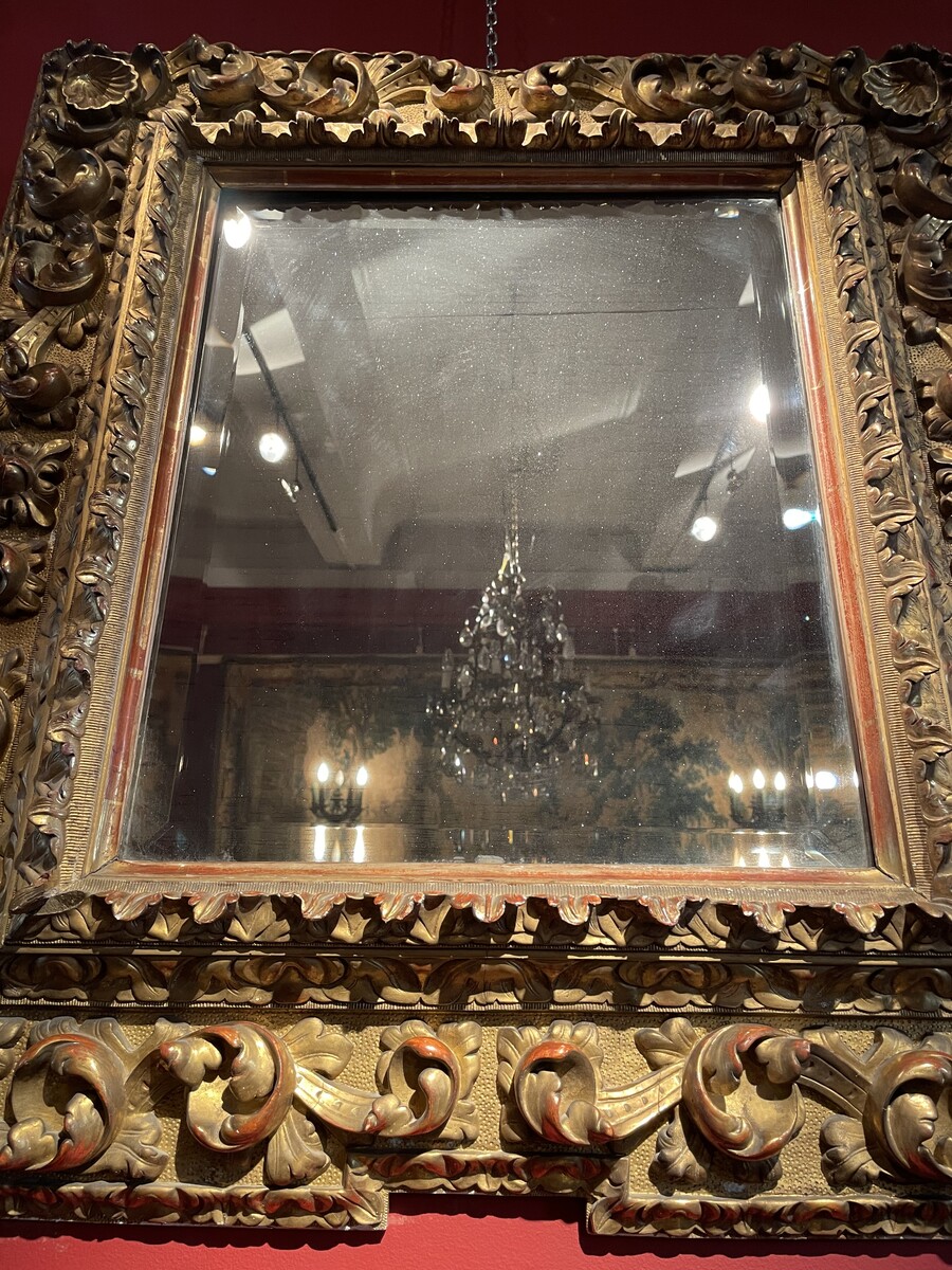 Baroque style mirror, the corners decorated with shells.