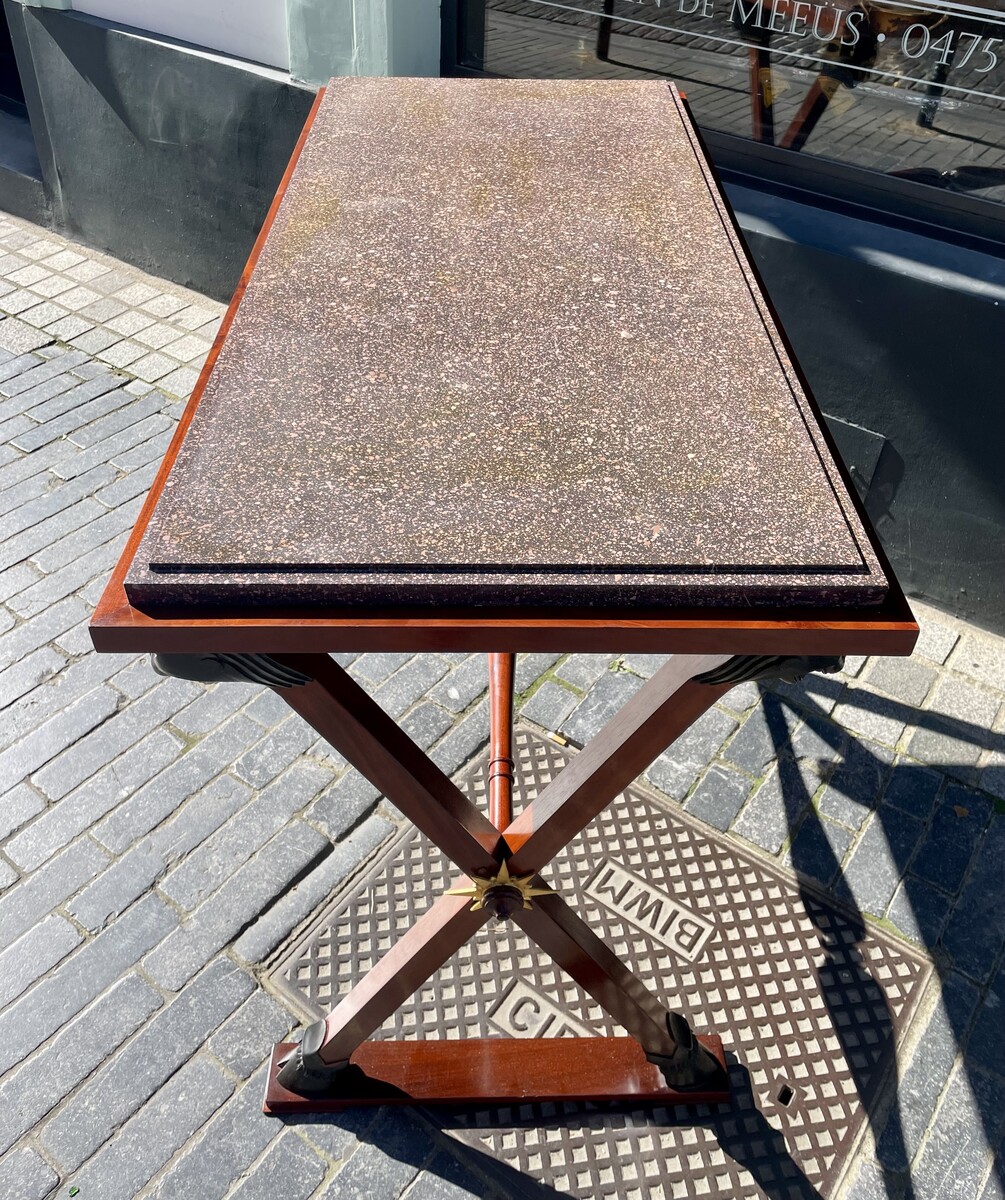 Directory style table decorated with lion heads.