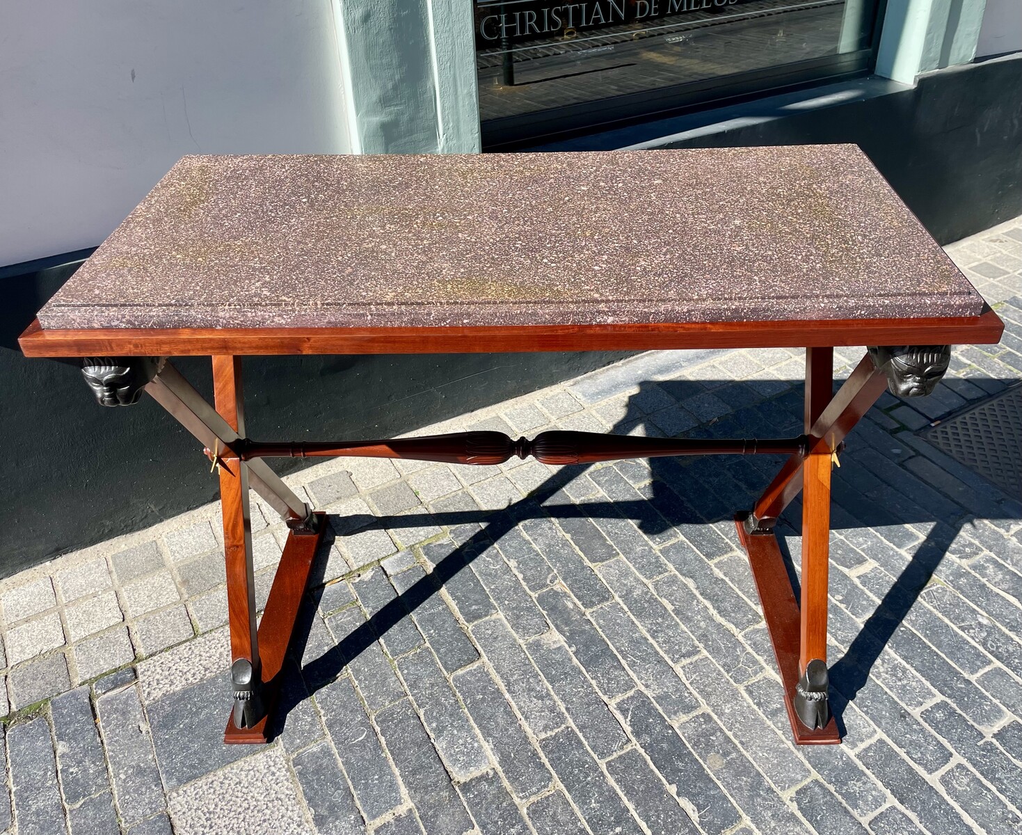 Directory style table decorated with lion heads.