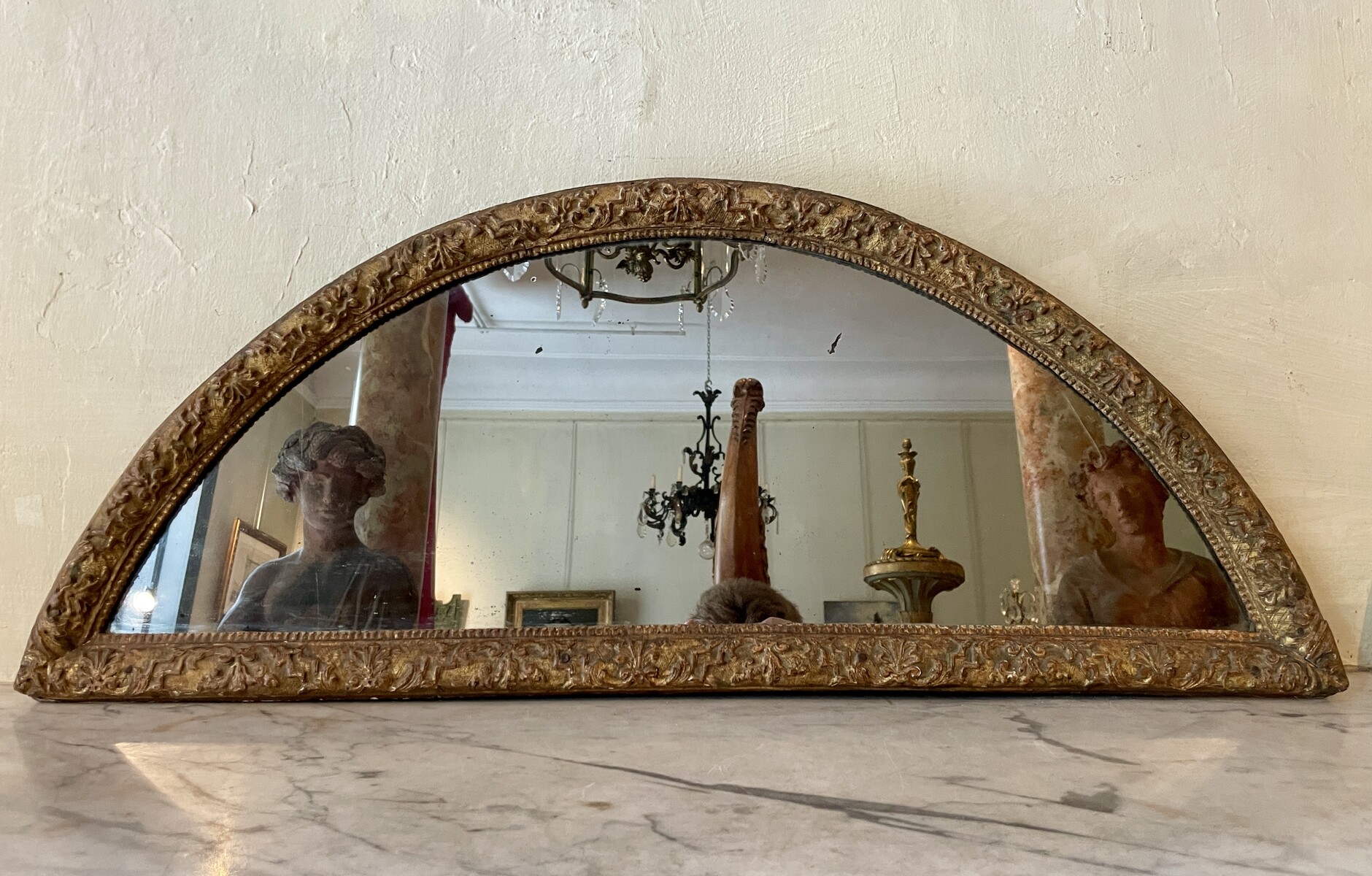 Half-moon-shaped mirror