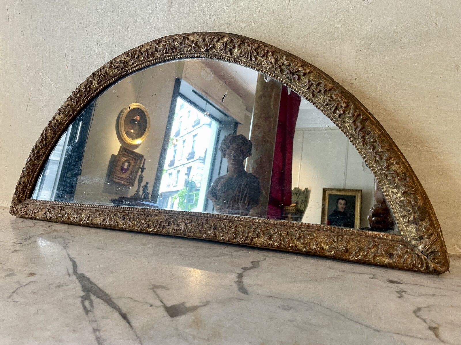 Half-moon-shaped mirror