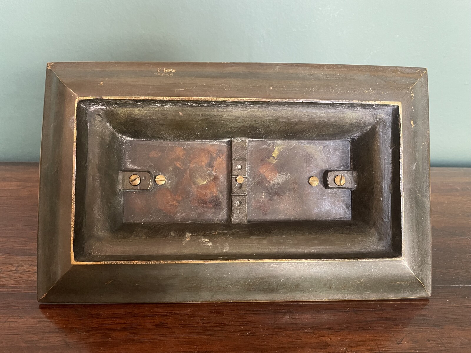 inkwell decorated with dolphins and a lily flower