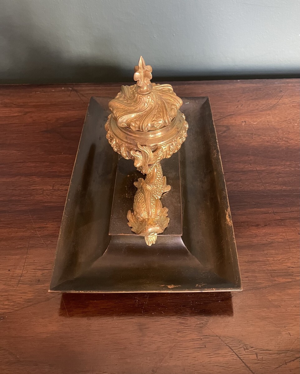 inkwell decorated with dolphins and a lily flower