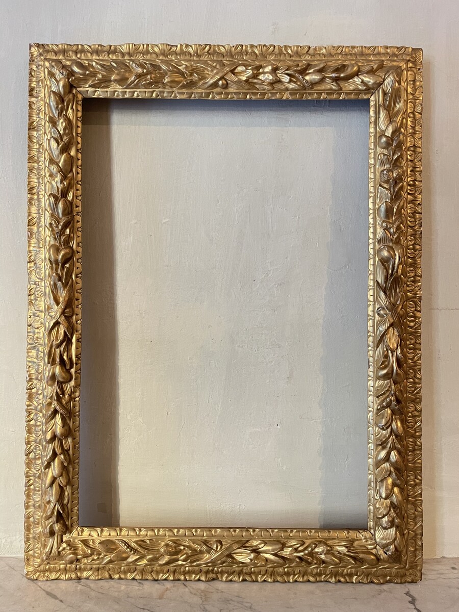 Louis XIV style frame decorated with wreaths of foliage and fruit
