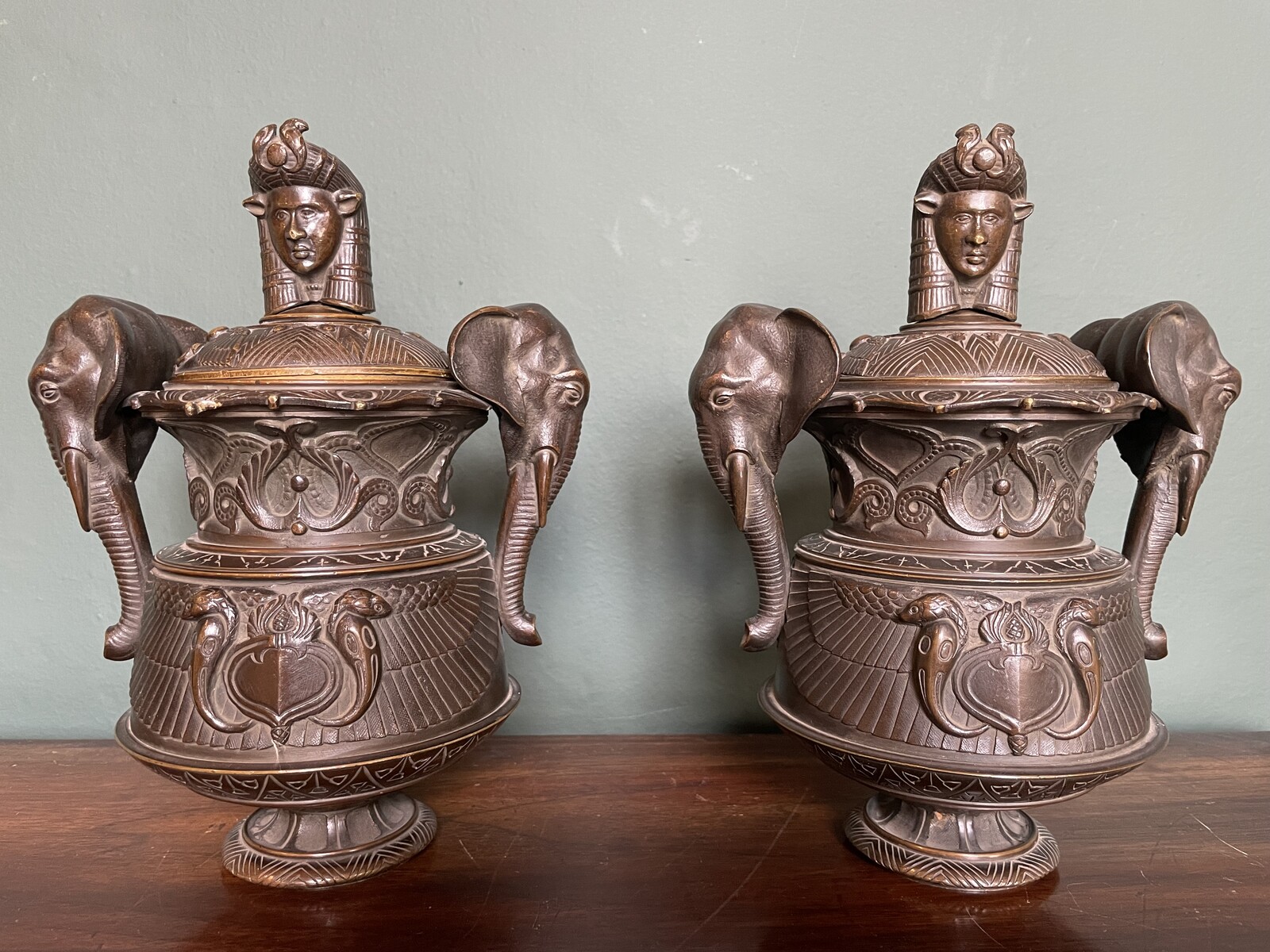 Pair of covered urns forming cigar holders, in the style of the return from Egypt