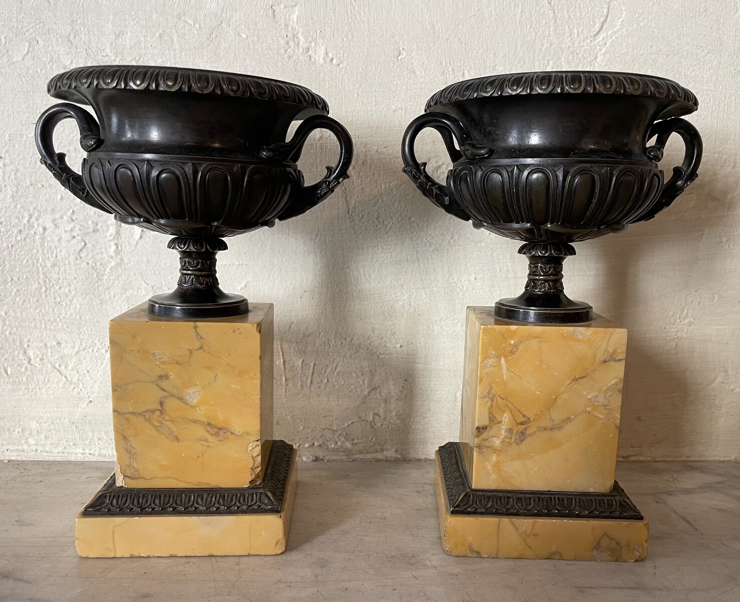 Pair of handle vases decorated with gadroons on base