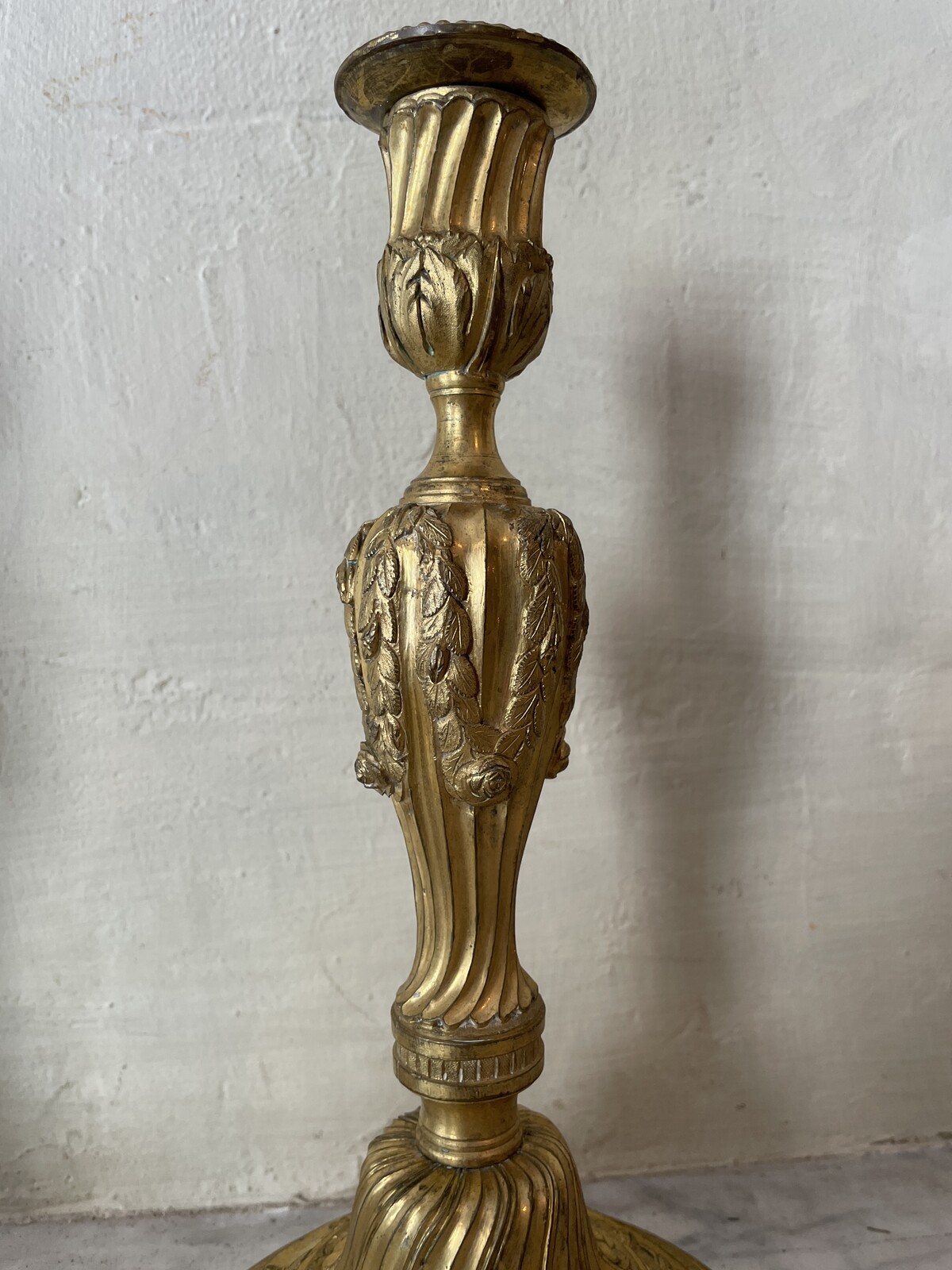 Pair of Louis XVI candlesticks with floral decoration.
