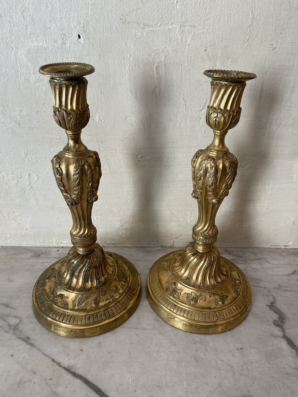Pair of Louis XVI candlesticks with floral decoration.