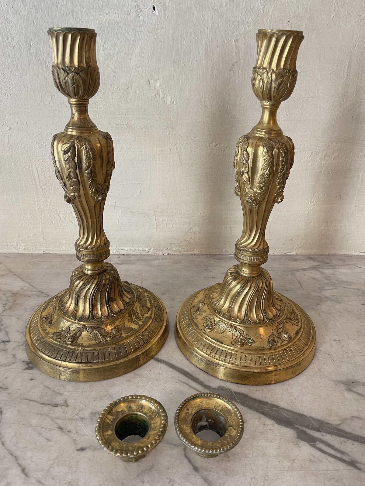 Pair of Louis XVI candlesticks with floral decoration.