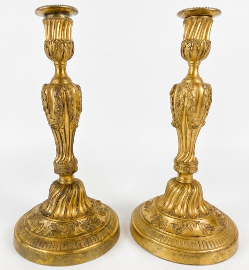 Pair of Louis XVI candlesticks with floral decoration.