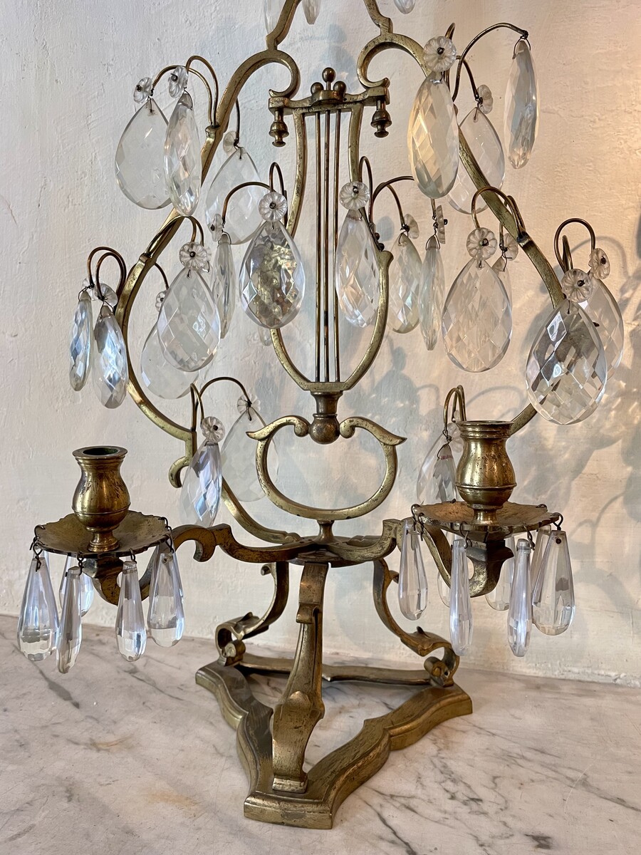 Pair of Régence style girandoles with lyre decoration