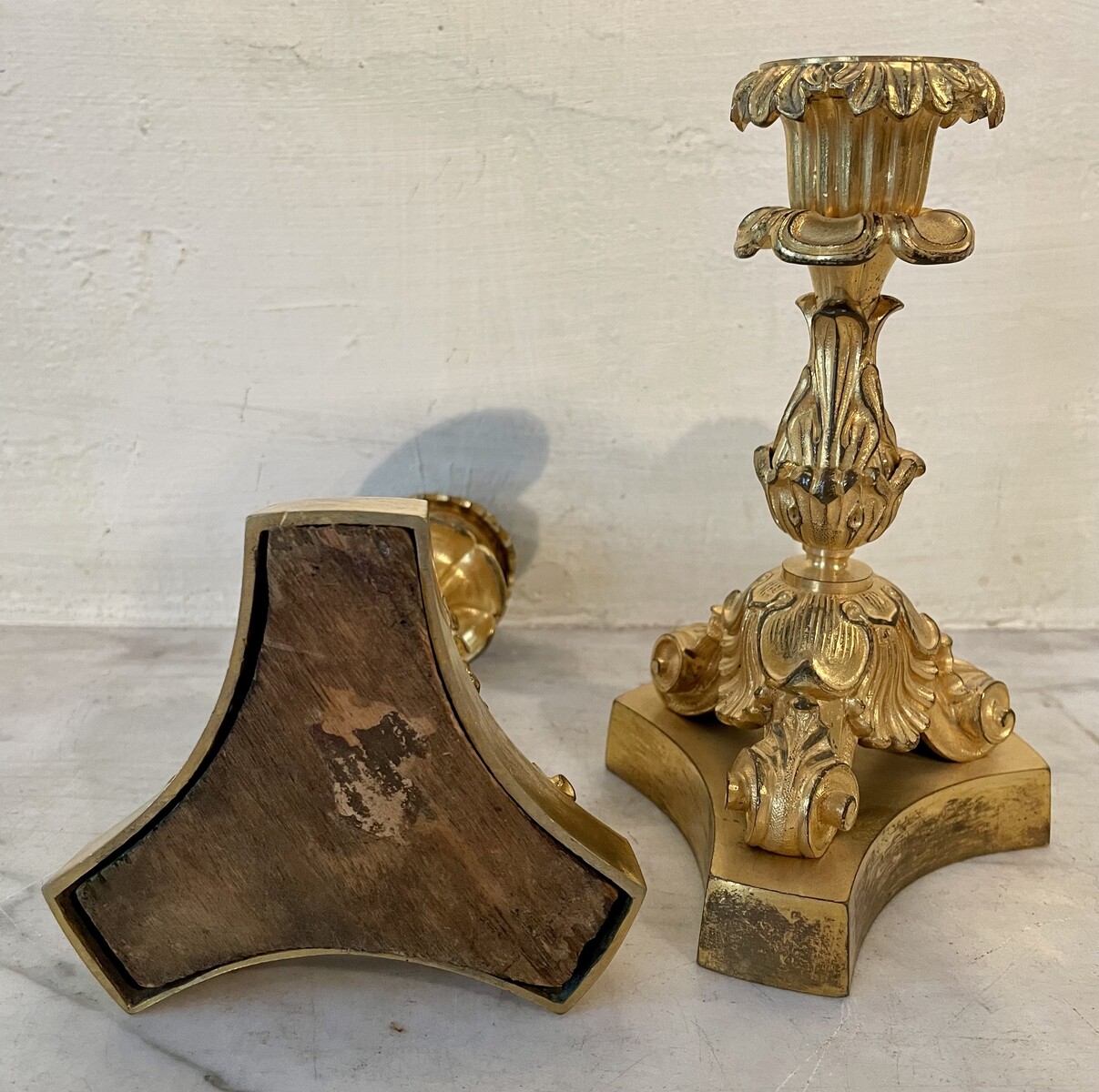 Pair of small candlesticks with vegetal and shell decoration