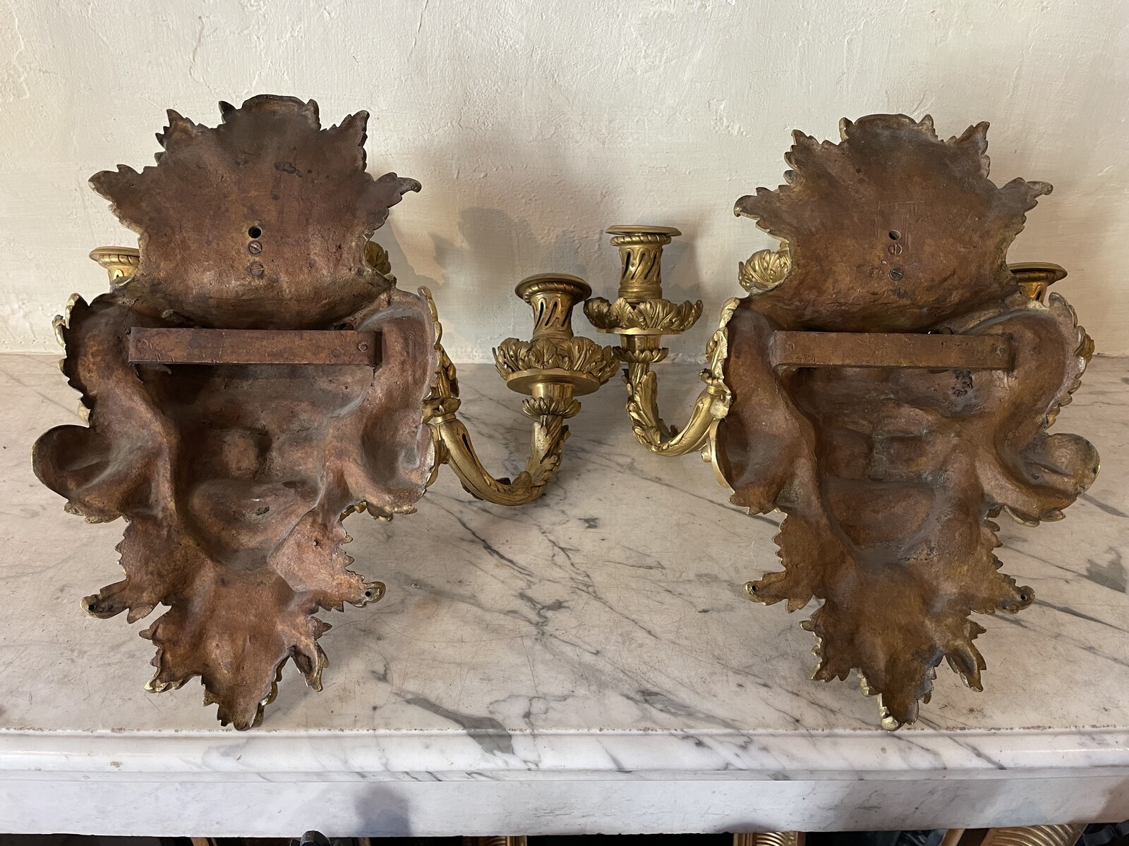 Pair of three-lights Regence style sconces