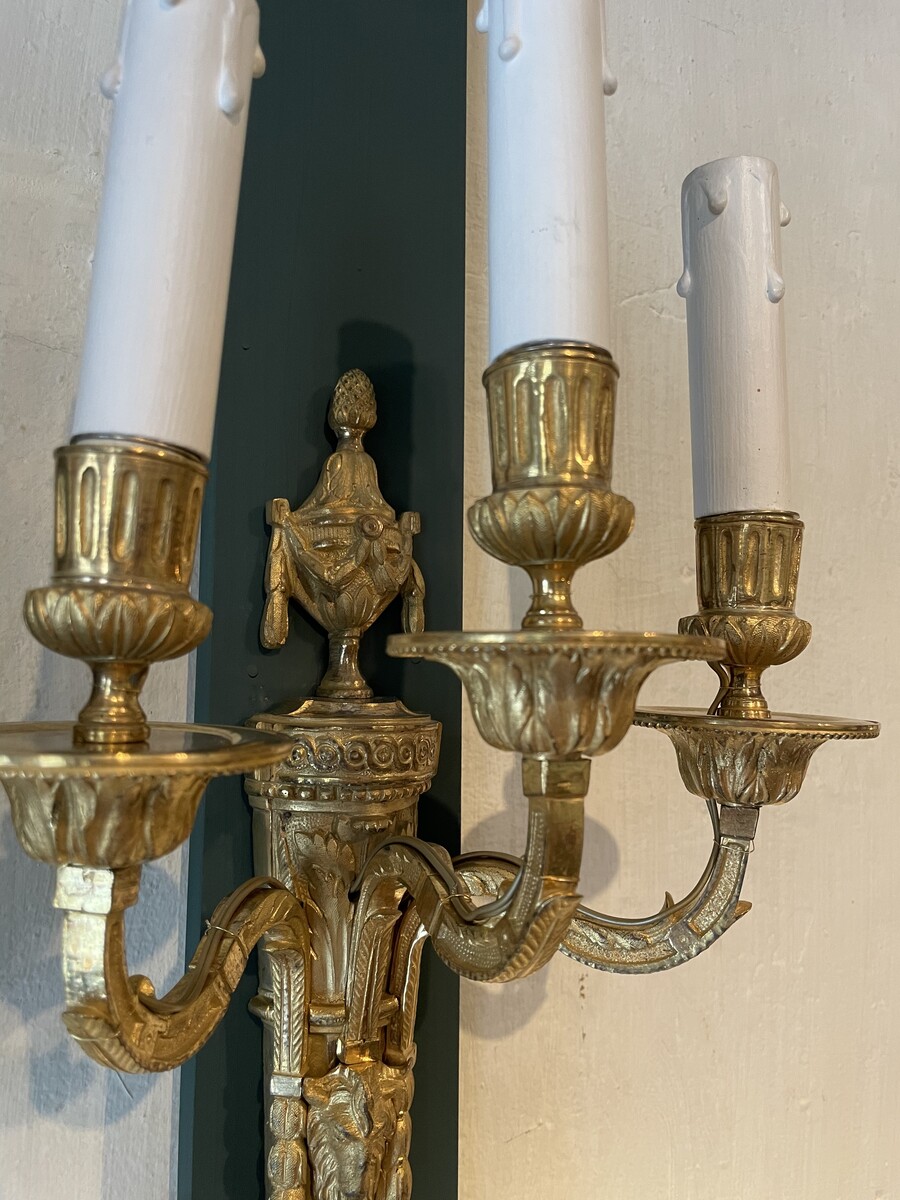 Pair of three-lights sconces in Louis XVI style