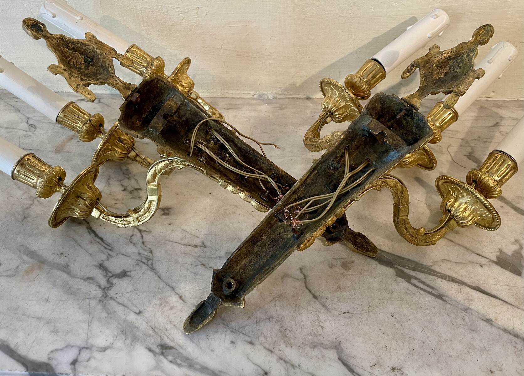 Pair of three-lights sconces in Louis XVI style