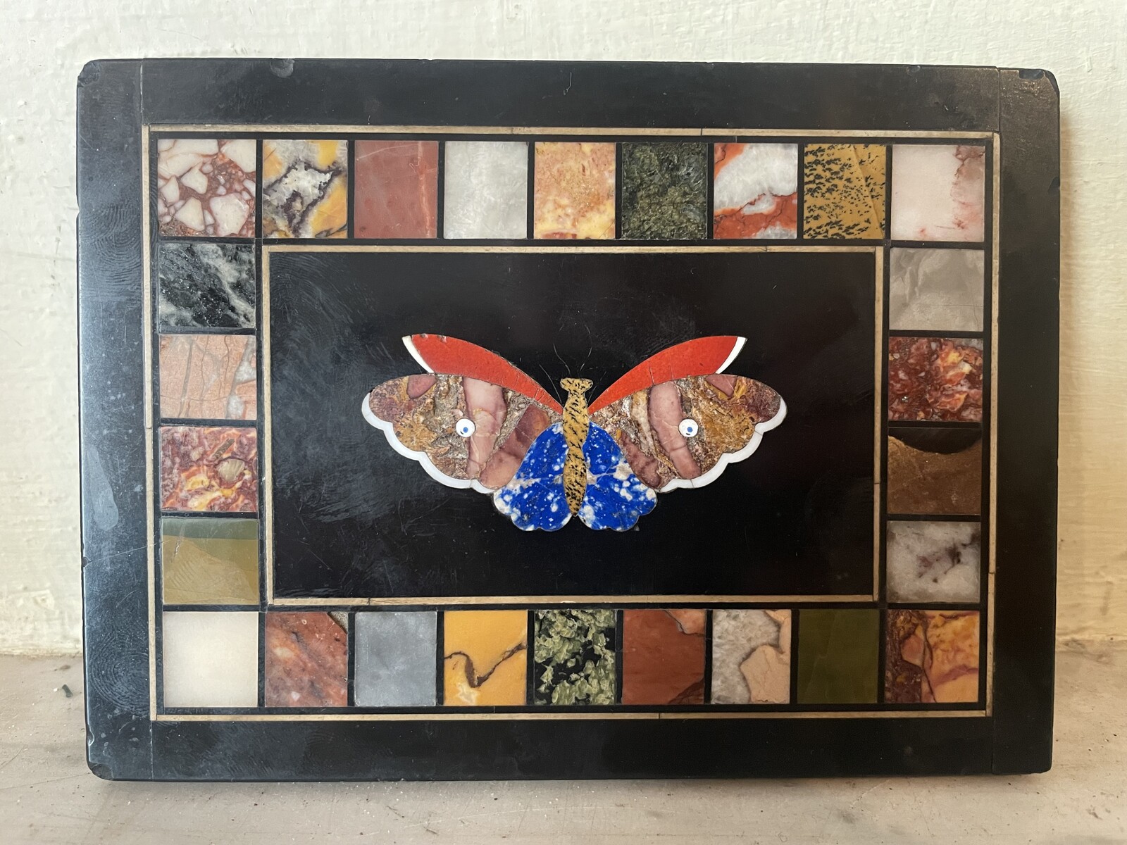 Plaque with inlaid decoration of a butterfly